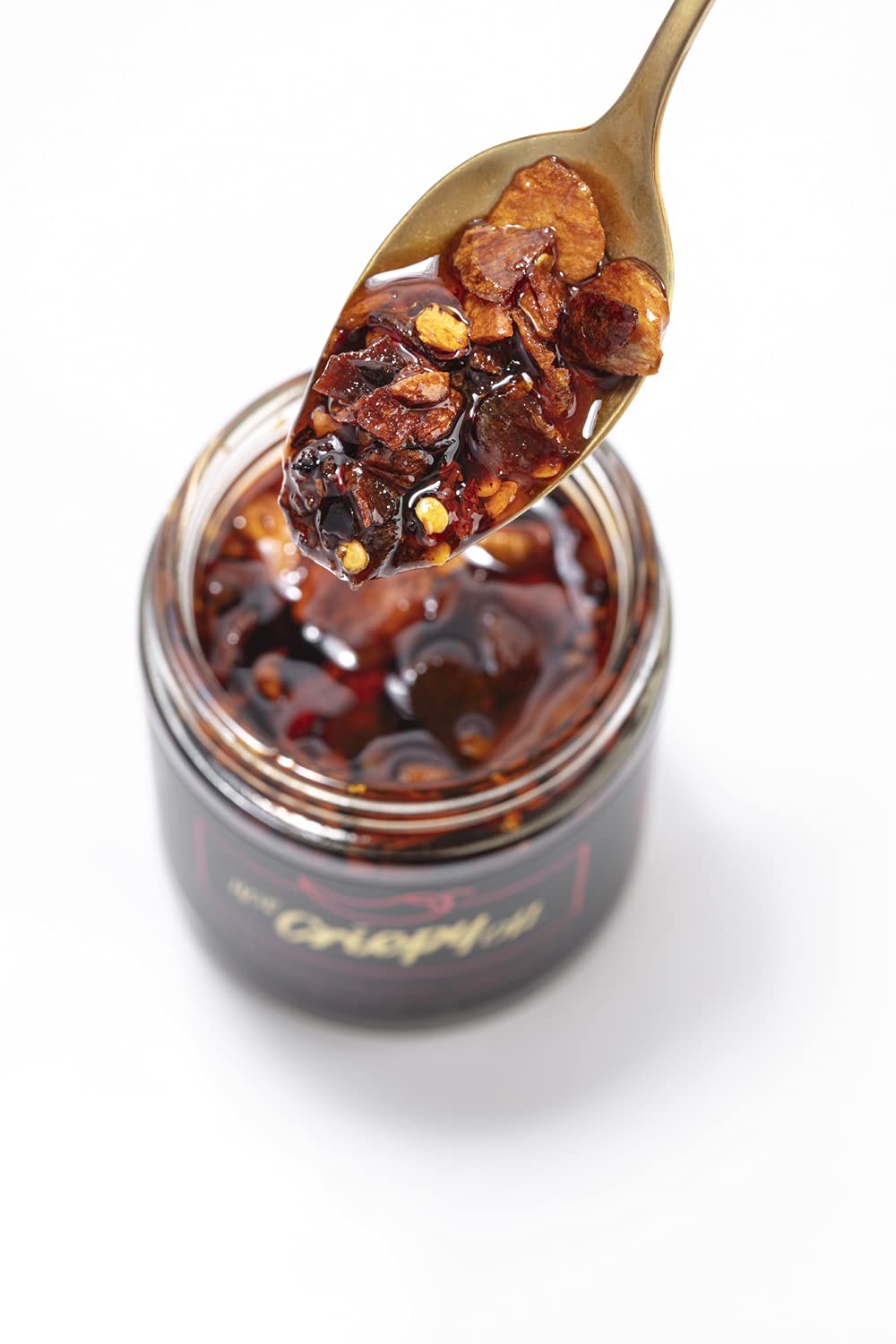 Hot Crispy Oil, An all natural unique blend of fresh fried shallots, fresh garlic and a proprietary blend of three different chi