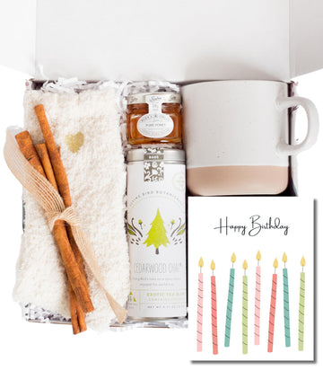 Unboxme Birthday Gift Basket for Women - Soothing Self Care Box with Fluffy Socks, Ceramic Mug, Chai Tea, Honey & Cinnamon for M