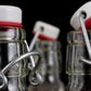 8.5 oz Swing Top Glass Bottle with Stainless Steel Wire Air Tight Leakproof Seal for Vanilla Extract