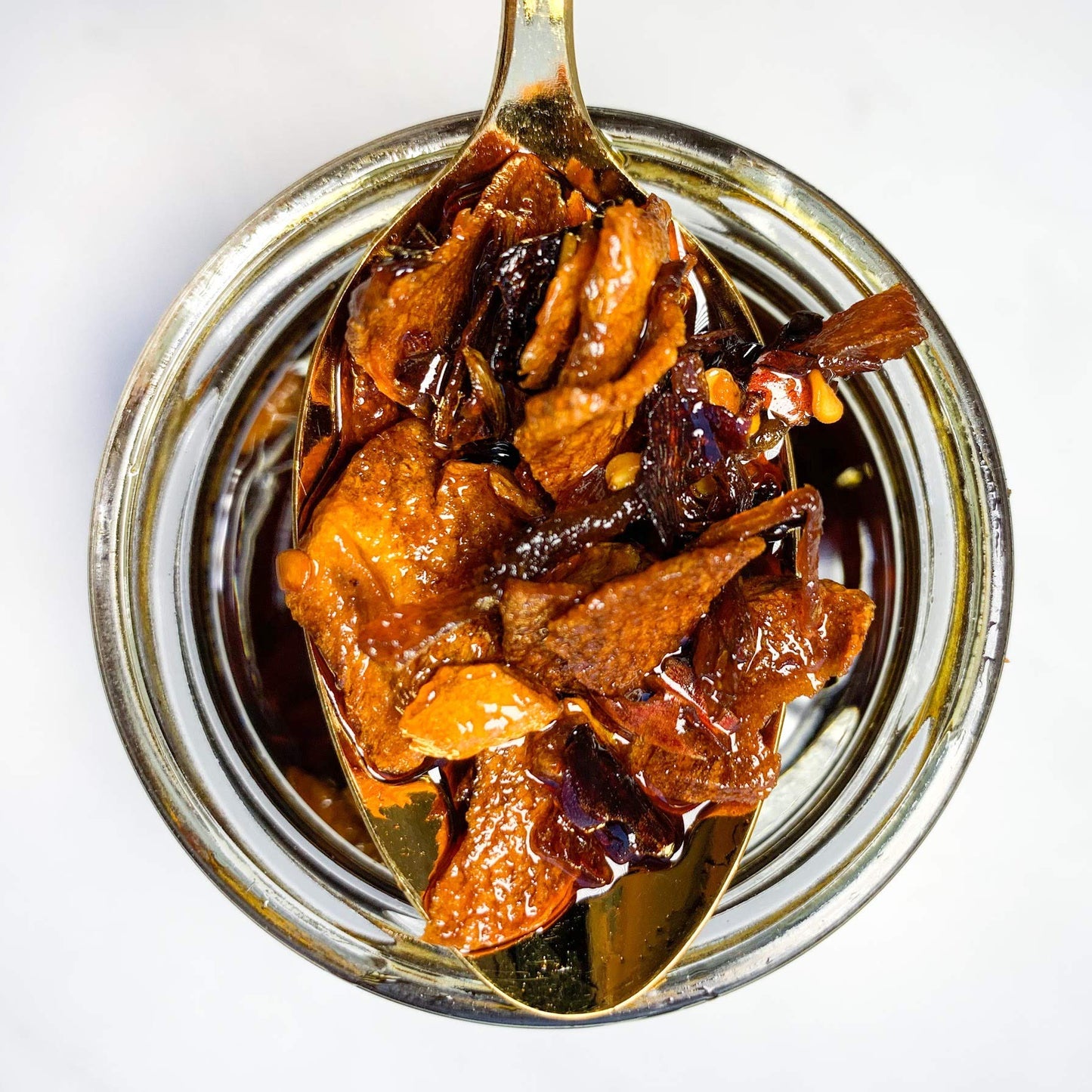 Hot Crispy Oil, An all natural unique blend of fresh fried shallots, fresh garlic and a proprietary blend of three different chi