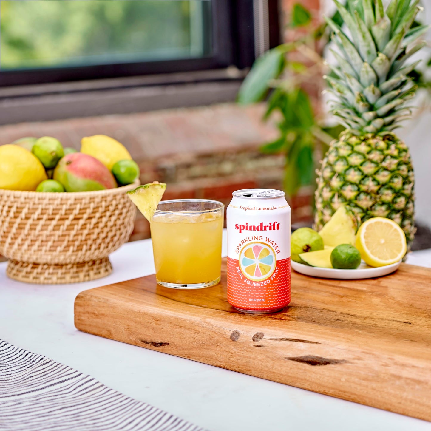 Spindrift Sparkling Water  Tropical Lemonade Flavored  Made with Real Squeezed Fruit  12 Fl OZ Cans  Pack of 24 (Only 13 Calories per Can)