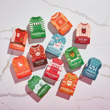 Thoughtfully  Holiday Hot Chocolate Mix Gift Set  Ugly Sweater Cocoa Sampler with 12 Flavored Packets Including Peppermint  Gingerbread  Rocky Road & More  Christmas Gift Box  Set of 12