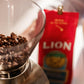 Lion Coffee Chocolate Macadamia Flavored Ground Coffee, Light Roast, Hawaiian Inspired Taste - 24 Ounce Bag