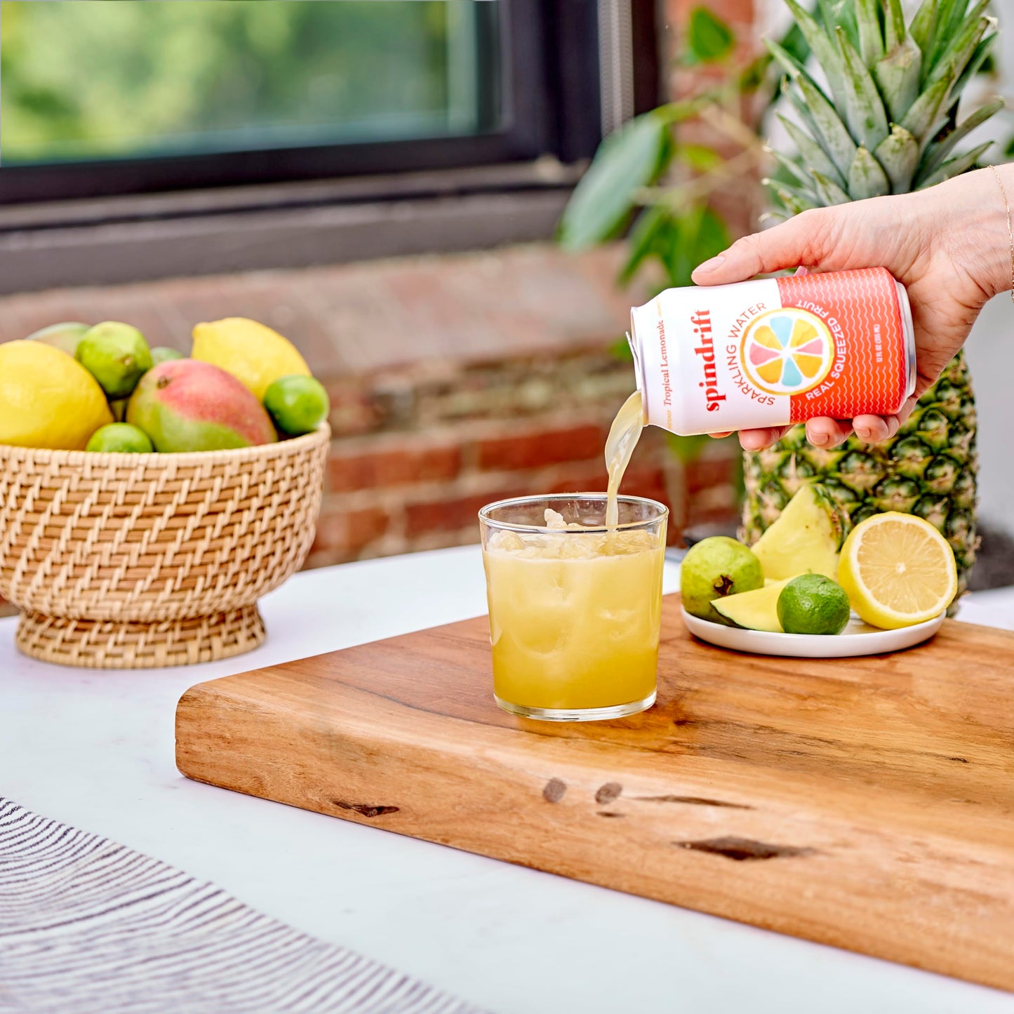 Spindrift Sparkling Water  Tropical Lemonade Flavored  Made with Real Squeezed Fruit  12 Fl OZ Cans  Pack of 24 (Only 13 Calories per Can)