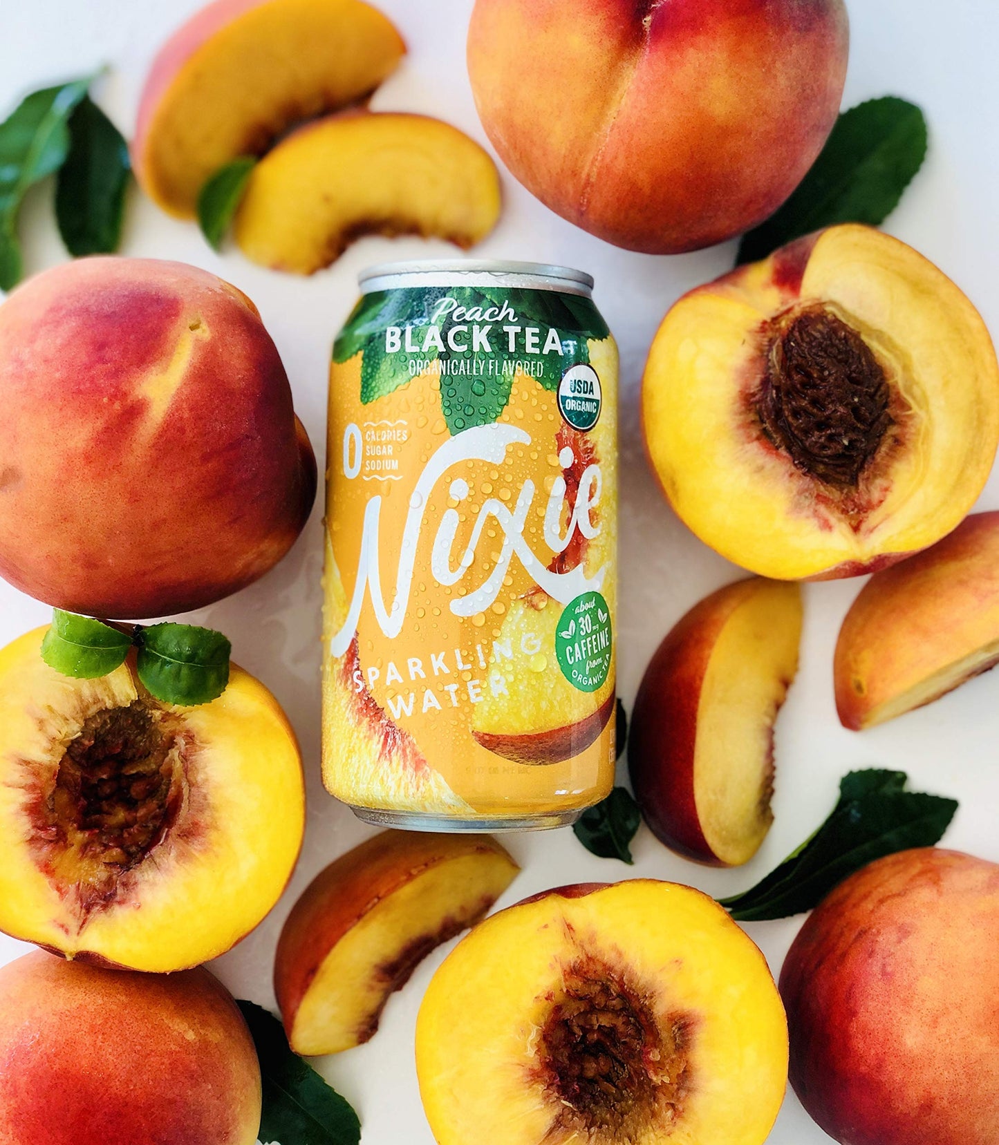 Nixie Sparkling Water, Peach Black Tea, Organic, Non-GMO, 12 fl oz cans, 24 pack, Lightly Caffeinated, 0 Calories, 0 Sugar