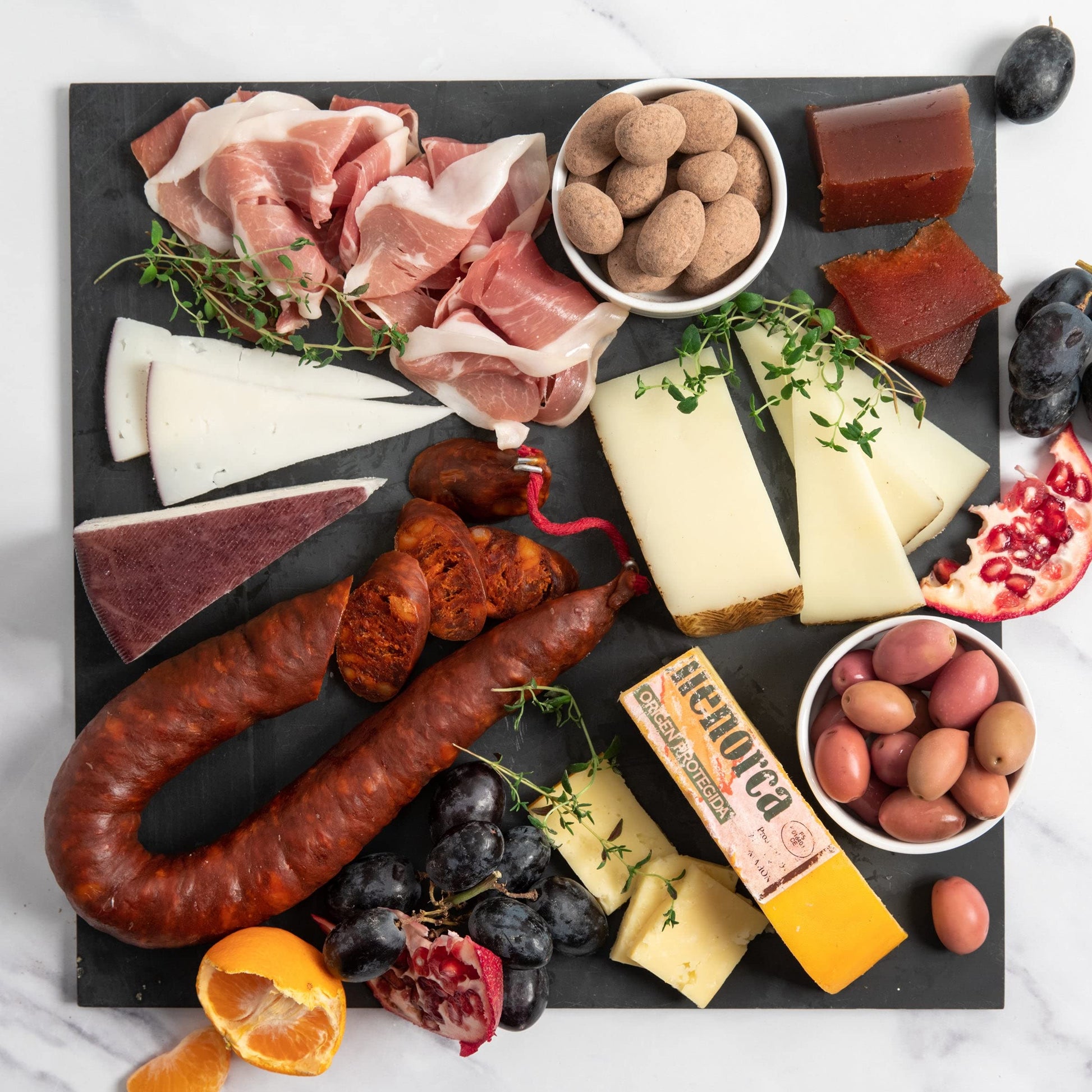 Igourmet The Best Of Scomfort Support Assortment - Includes: Gourmet Spanish Ham  Manchego Cheese  Drunken Goat Cheese  Mahon Cheese  Spanish Olives  Chocolates  Chorizo  And Quince Paste (Membrillo)