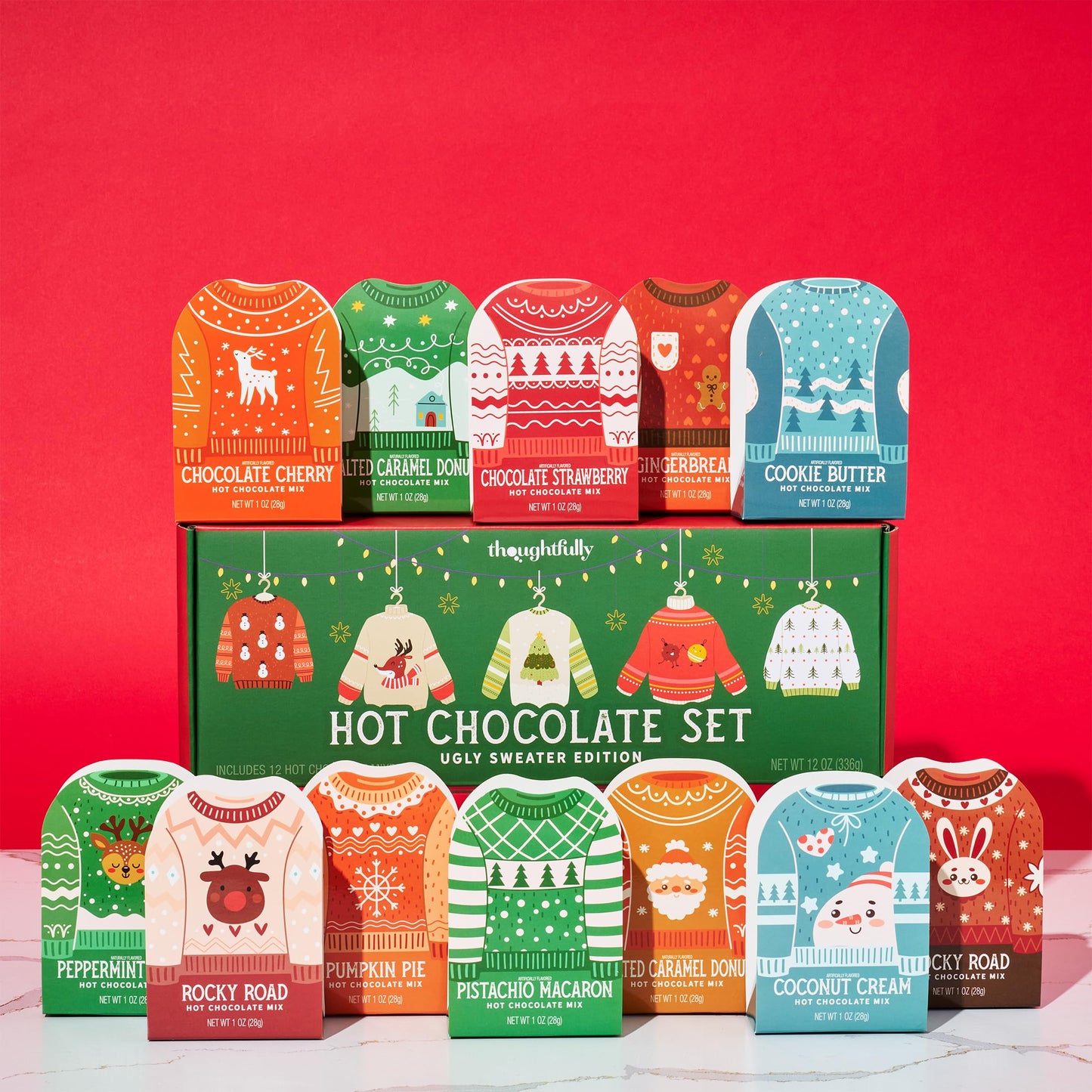 Thoughtfully  Holiday Hot Chocolate Mix Gift Set  Ugly Sweater Cocoa Sampler with 12 Flavored Packets Including Peppermint  Gingerbread  Rocky Road & More  Christmas Gift Box  Set of 12